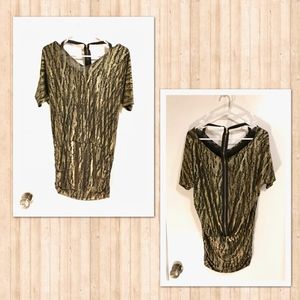 Black and gold mini dress with a retro feel